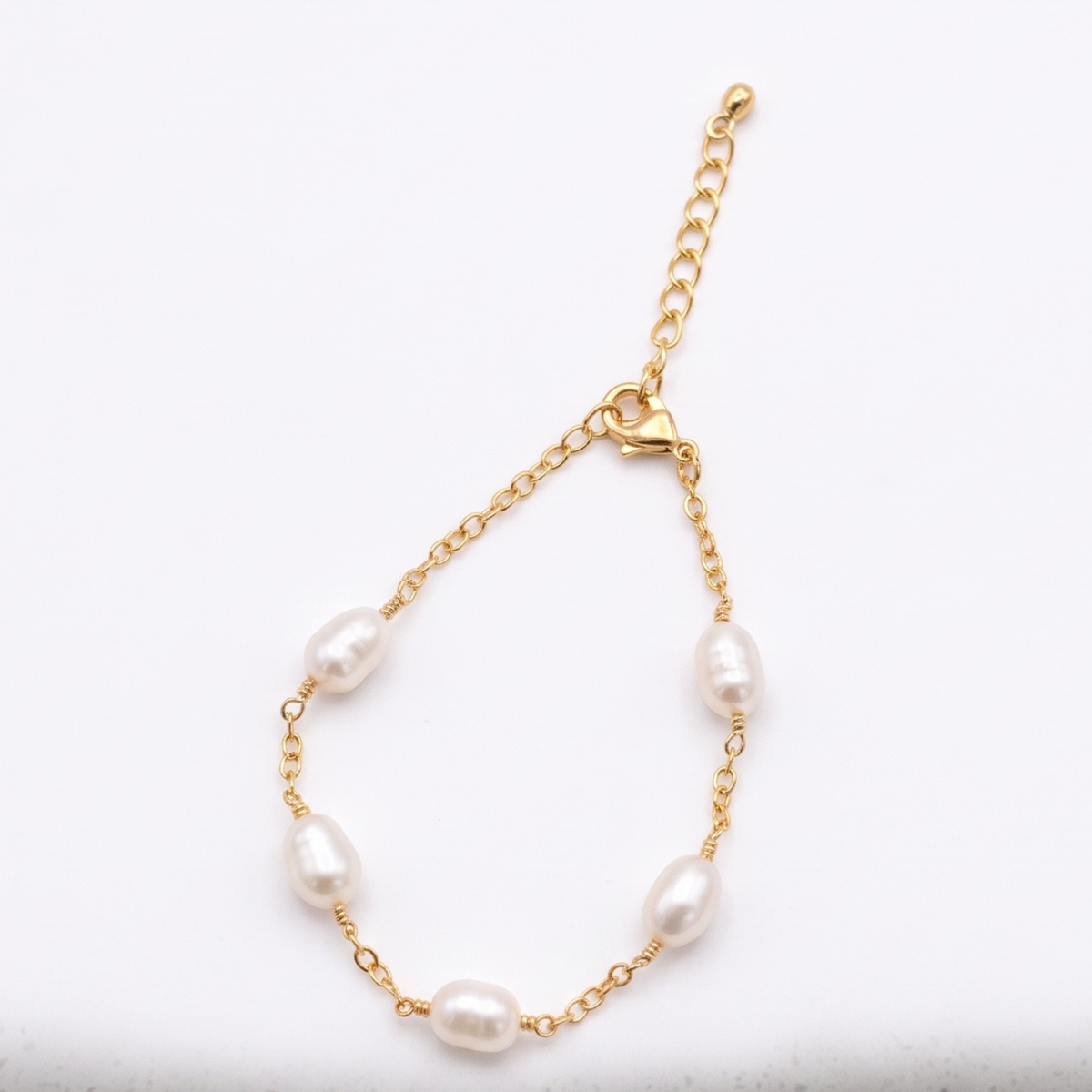 Pulsera Olivia | Pulsera de Perlas de Río Naturales Torcidas Baño Oro 18K con Cadena Extensora